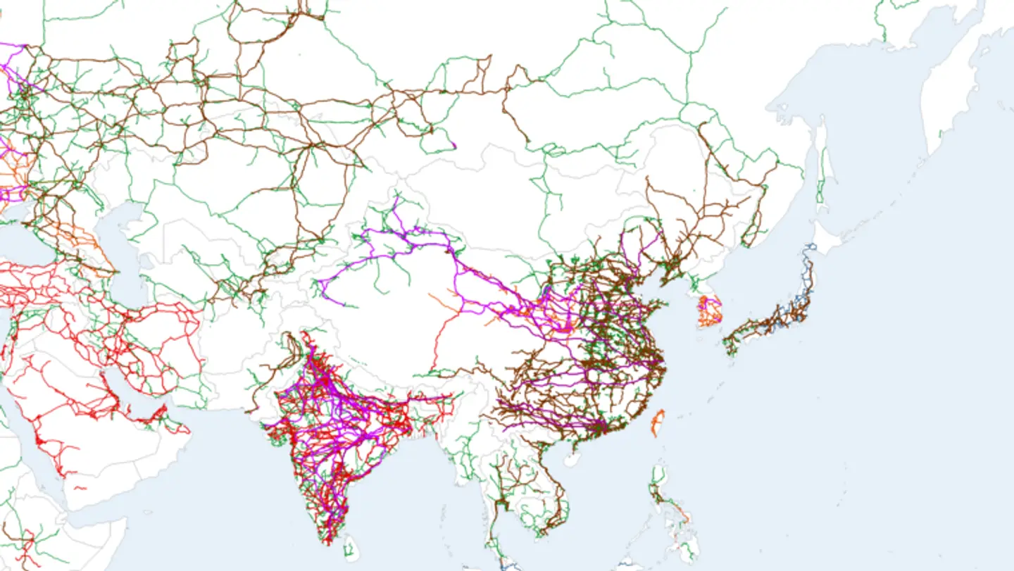 A cropped OpenStreetMap-derived map of East Asia showing dense high-voltage power lines across China and long lines reaching inland.
